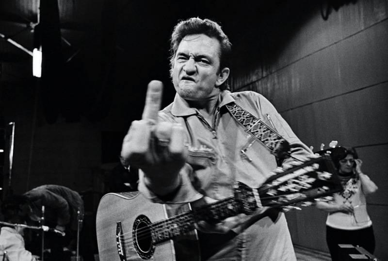 Jim Marshall. “Johnny Cash (Flipping the Bird), San Quentin Prison” (1969), Sandro Miller, 2014
