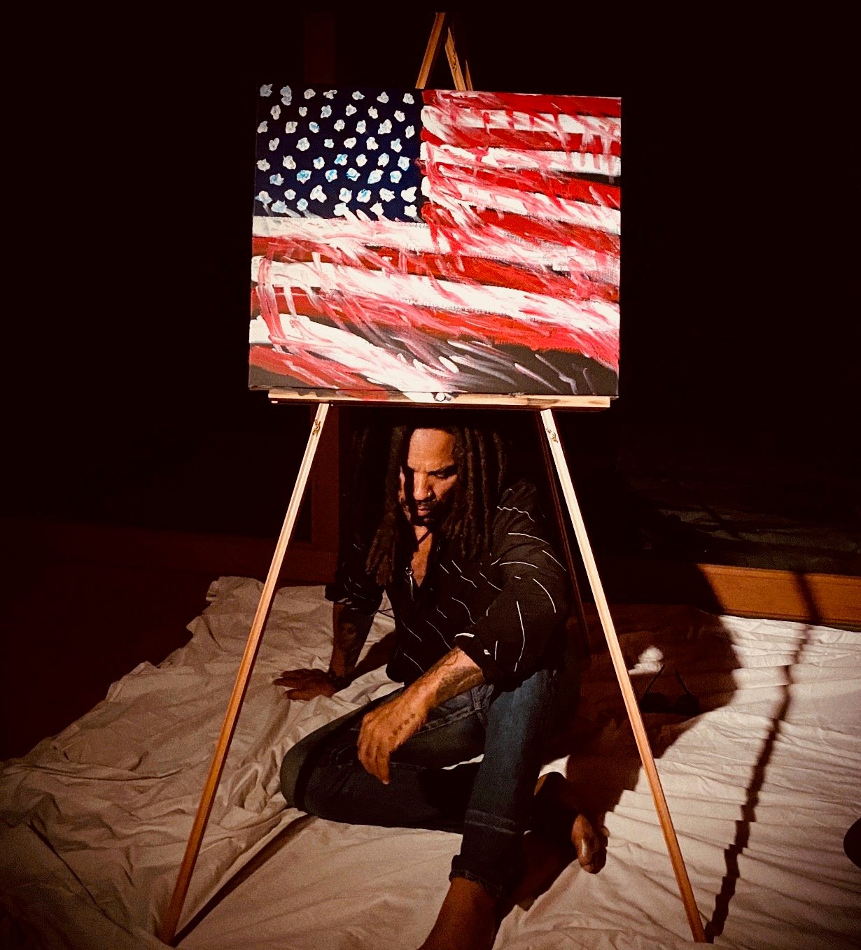 Lenny Kravitz with his untitled painting for the “Show Me the Signs” auction. Photo courtesy of the African American Policy Forum.