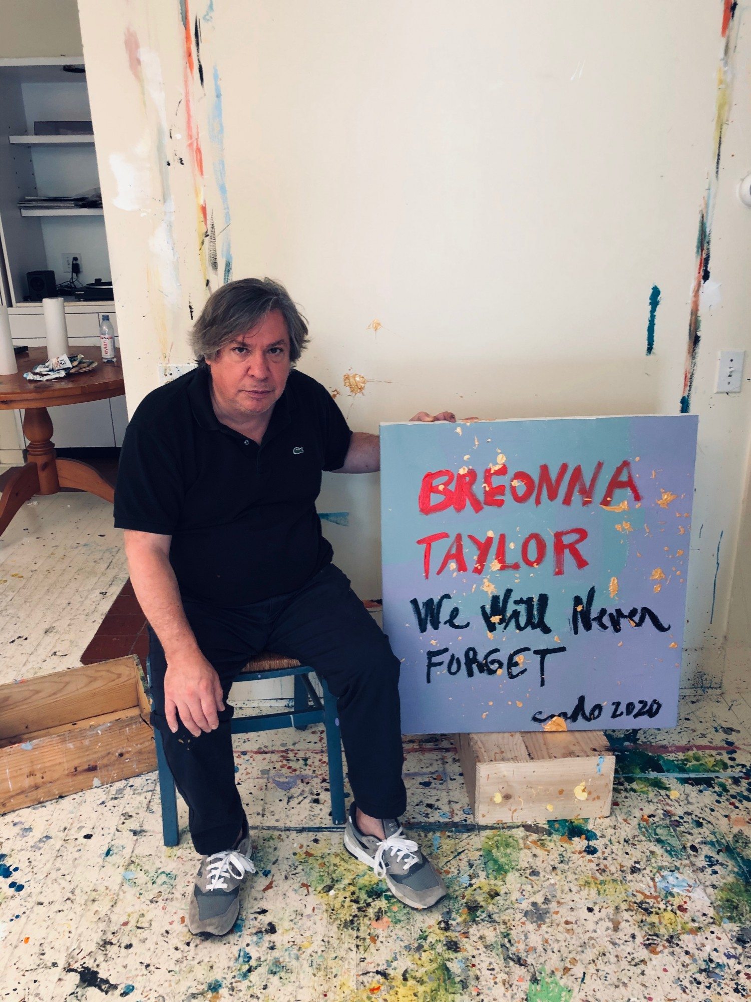 George Condo with his painting “Painting for Breonna Taylor” for the “Show Me the Signs” auction. Photo courtesy of the African American Policy Forum.