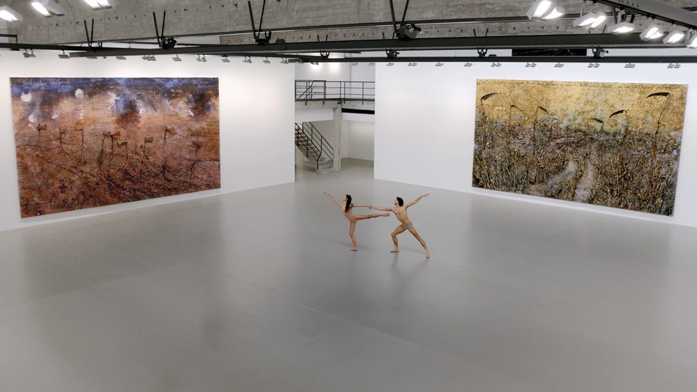 Dancers Hugo Marchand and Hannah O’Neill performing in “Anselm Kiefer: Field of the Cloth of Gold” at Gagosian, Le Bourget