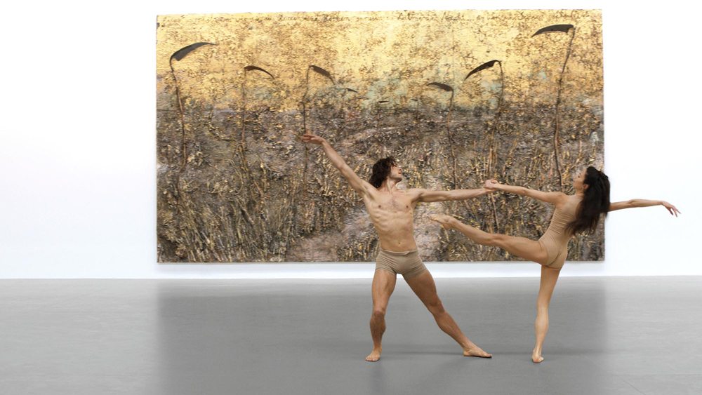 Dancers Hugo Marchand and Hannah O’Neill performing in “Anselm Kiefer: Field of the Cloth of Gold” at Gagosian, Le Bourget