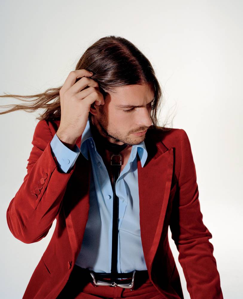 Valentin Ranger is wearing a velvet suit, poplin cotton shirt and harness, GUCCI.