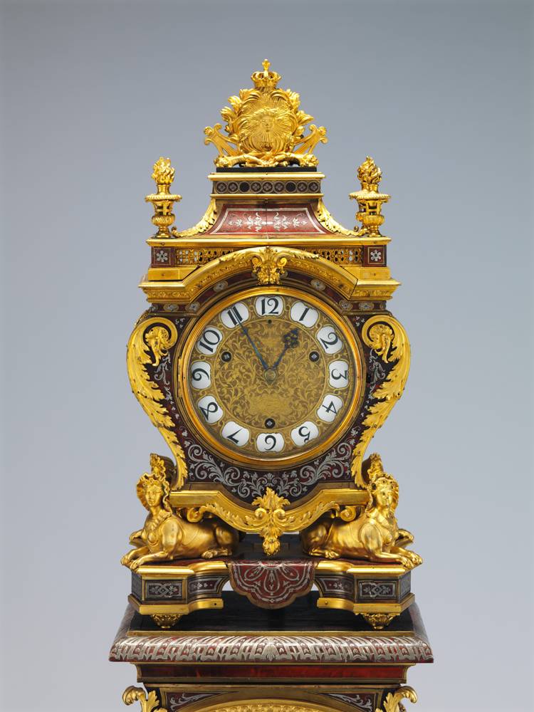 Case attributed to André Charles Boulle (French, 1642–1732); After a design by Jean Berain (French, 1640–1711); Clock by Jacques III Thuret (1669–1738) or more likely his father, Isaac II Thuret (1630–1706) Clock with pedestal, ca. 1690 Case and pedestal of oak with marquetry of tortoiseshell, engraved brass, and pewter; gilt bronze; dial of gilt brass with white enameled Arabic numerals; movement of brass and steel 87 1/4 x 13 3/4 x 11 3/8 in. (221.6 x 34.9 x 28.9 cm) The Metropolitan Museum of Art, New York, Rogers Fund, 1958 (58.53a–c)