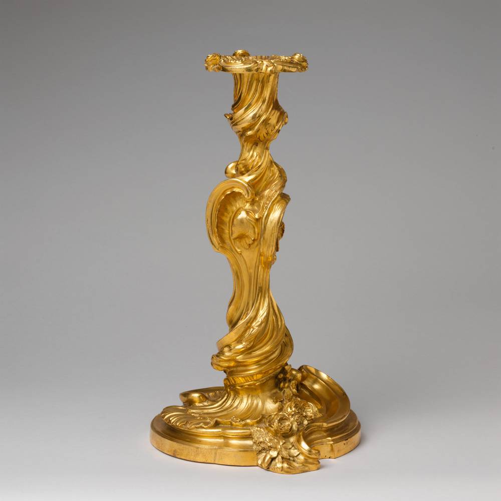 After designs by Juste Aurèle Meissonnier (French, 1695–1750) One of a pair of candlesticks (flambeaux or chandeliers), 1735–50 Gilt bronze 12 1/8 × 7 3/8 × 7 3/8 in. (30.8 × 18.7 × 18.7 cm) The Metropolitan Museum of Art, Gift of Mrs. Charles Wrightsman, 1999 (1999.370.1a, b, .2a, b)