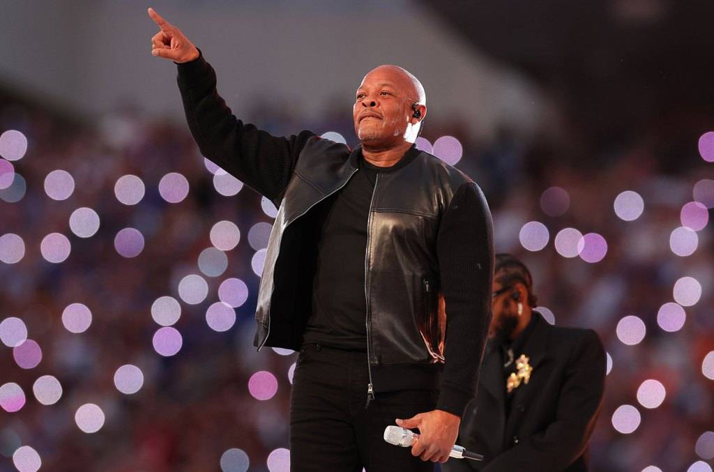 Dr Dre in a Mndatory leather bomber jacket.