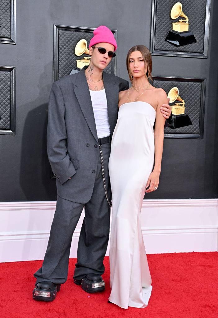 Justin Bieber wearing Balenciaga and Hailey Bieber in a Saint Laurent gown (Photo by Axelle/Bauer-Griffin/FilmMagic ©Getty)