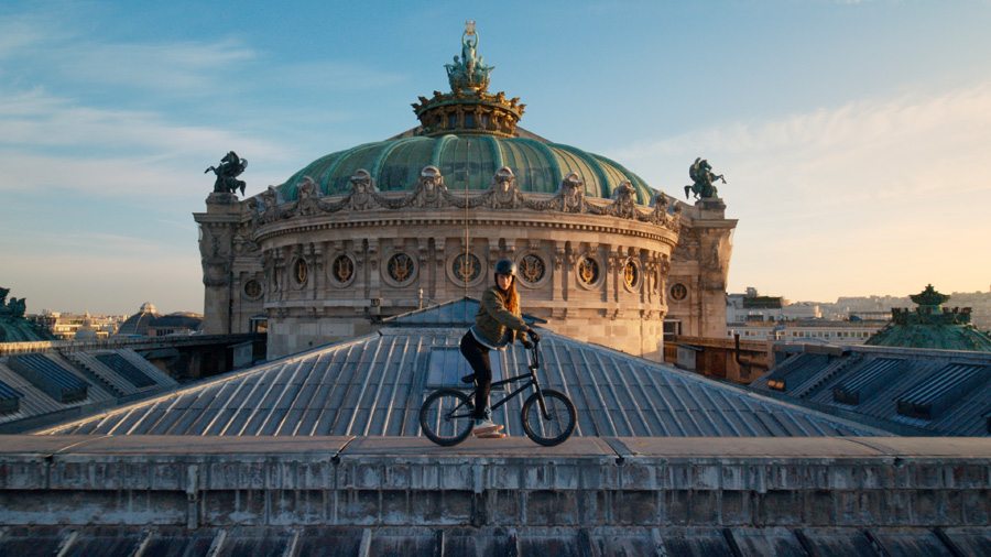 Still tiré du film “Rider”(version longue) avec la championne de BMX Estelle Majal sur le toit de l'Opéra Garnier à Paris, diffusé dans le cadre de la cérémonie de passation des jeux de Tokyo à Paris 
© Valentin Petit