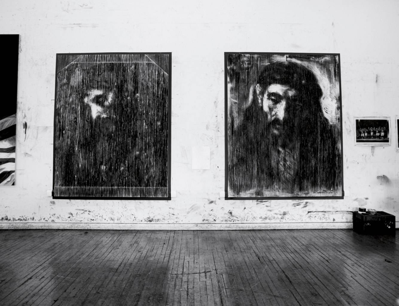 View of the studio. These Robert Longo works were made after representations of Jesus Chris drawn by Rembrandt.