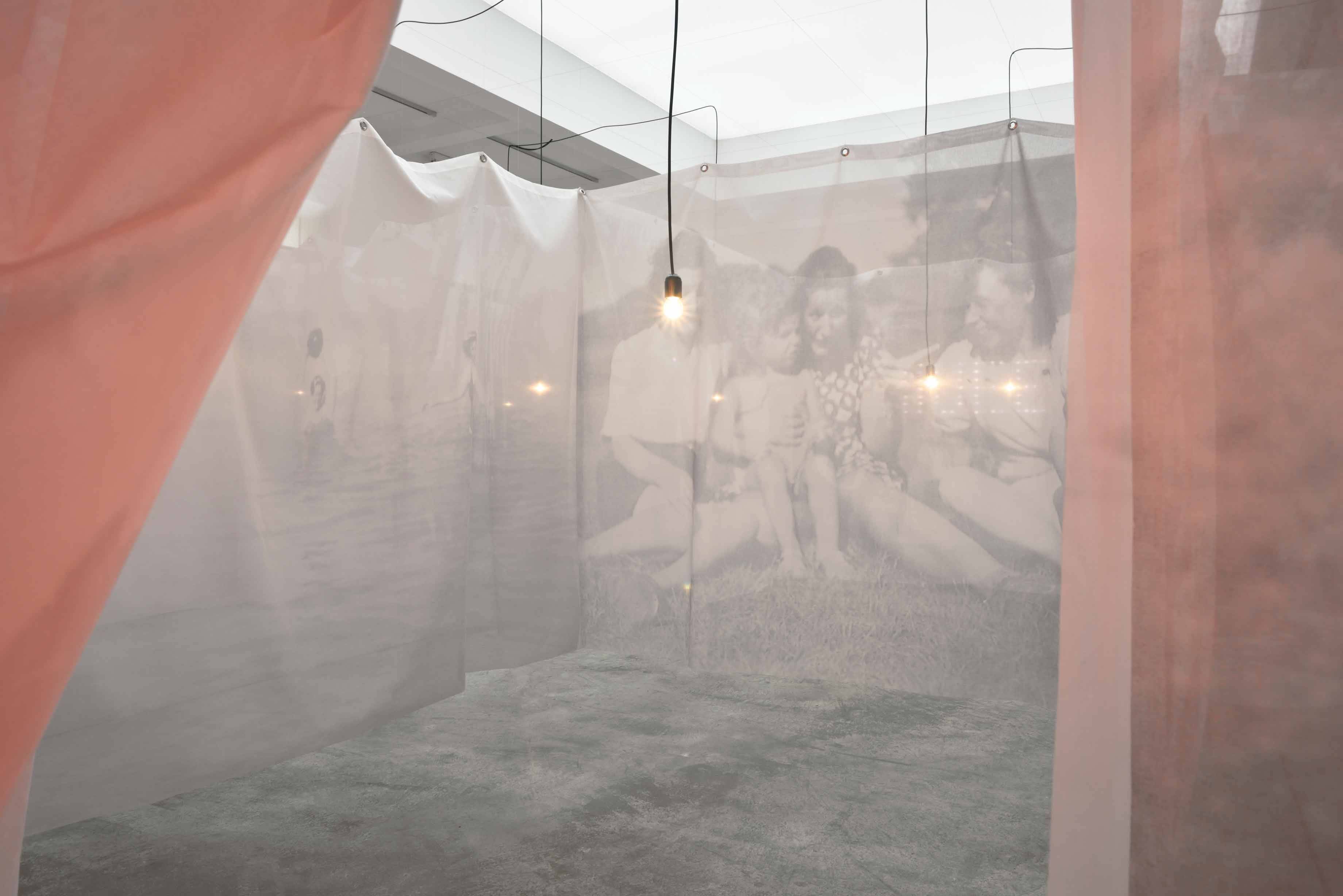 La traversée de la vie, 2015, 32 printed veils, 12 light bulbs,wire, electric wire.     Courtesy de l'artiste et Marian Goodman Gallery.  Photo : Rébecca Fanuele