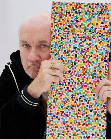 Damien Hirst with works from The Currency (2016). Artwork © Damien Hirst and Science Ltd, DACS 2021. Photo: Prudence Cuming Associates Ltd