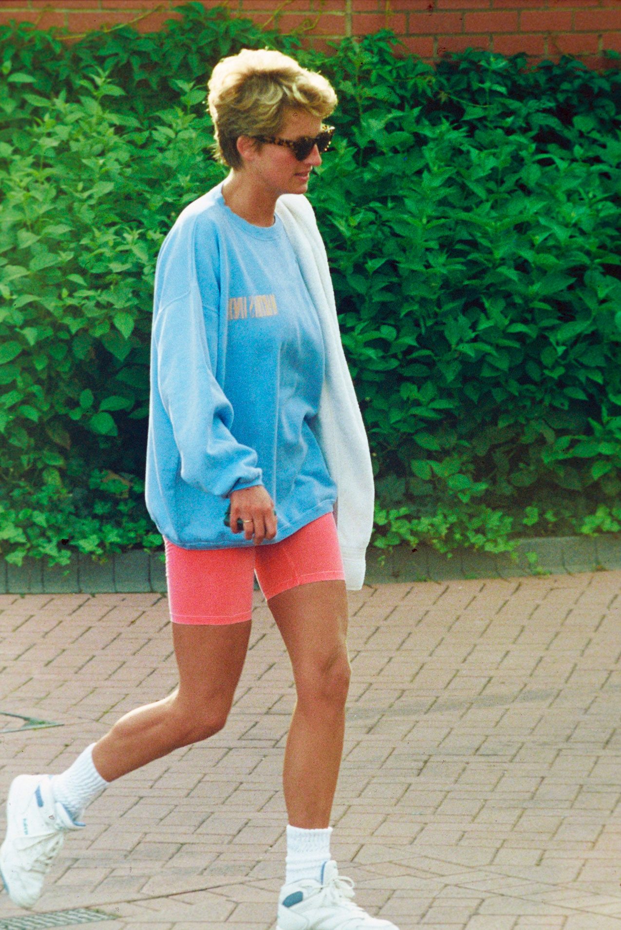 Princess Diana wearing one of her famous bike shorts in 1994. © Photo by Anwar Hussein/WireImage