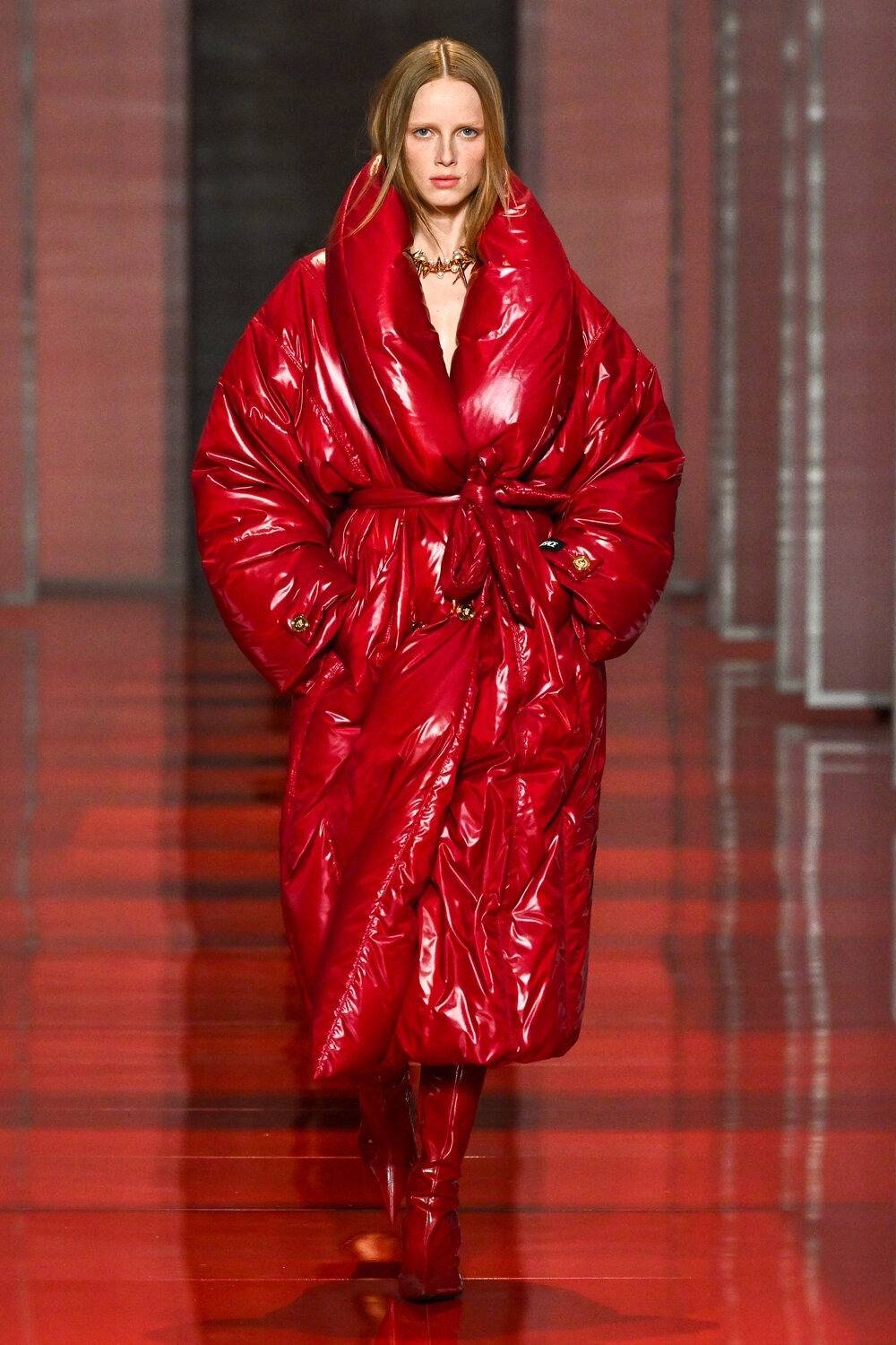 Versace’s red vinyl maxi down jacket Fall-Winter 2022-2023