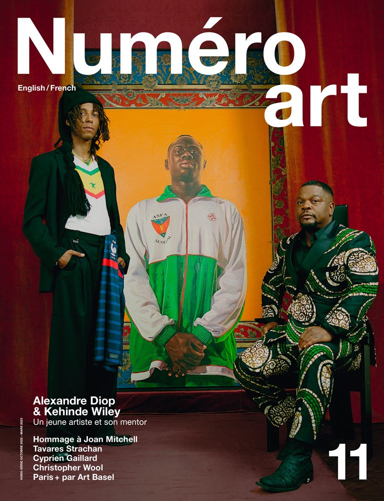 Alexandre Diop and Kehinde Wiley in front of the artwork, “Idrissa Ndiaye” (2012). Oil on canvas, 243,8 x 13,4 cm. Thanks to the gallery Templon. Portrait by Kenny Germé.
Alexandre Diop wears a jacket by NINA RICCI, pants by EYTYS and derbys by SITUATIONIST. Kehinde Wiley wears his own suit, a shirt by FIGARET and boots by GMBH.
Make up: Lauren Bos with products of Laura Mercier at Artlist Paris. Set design : Félix Gesnouin at Total World.