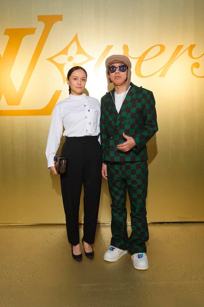 Nigo and Riho Makise at the Louis Vuitton show by Pharrell Williams