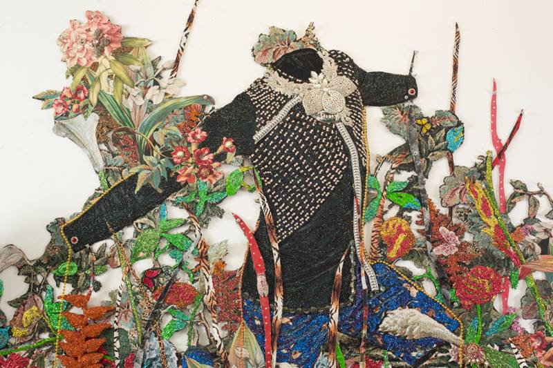 Ebony G. Patterson. “. . . a wailing black horse . . . for those who bear/bare witness”, 2018 (detail). Hand cut jacquard photo tapestry with glitter, appliques, pins, embellishments, fabric, tassels, brooches, acrylic, glass pearls, beads, hand cast embellished heliconias, shelf, embellished resin owl, and artist-designed fabric wallpaper (not pictured). Courtesy the artist and Monique Meloche Gallery, Chicago. 