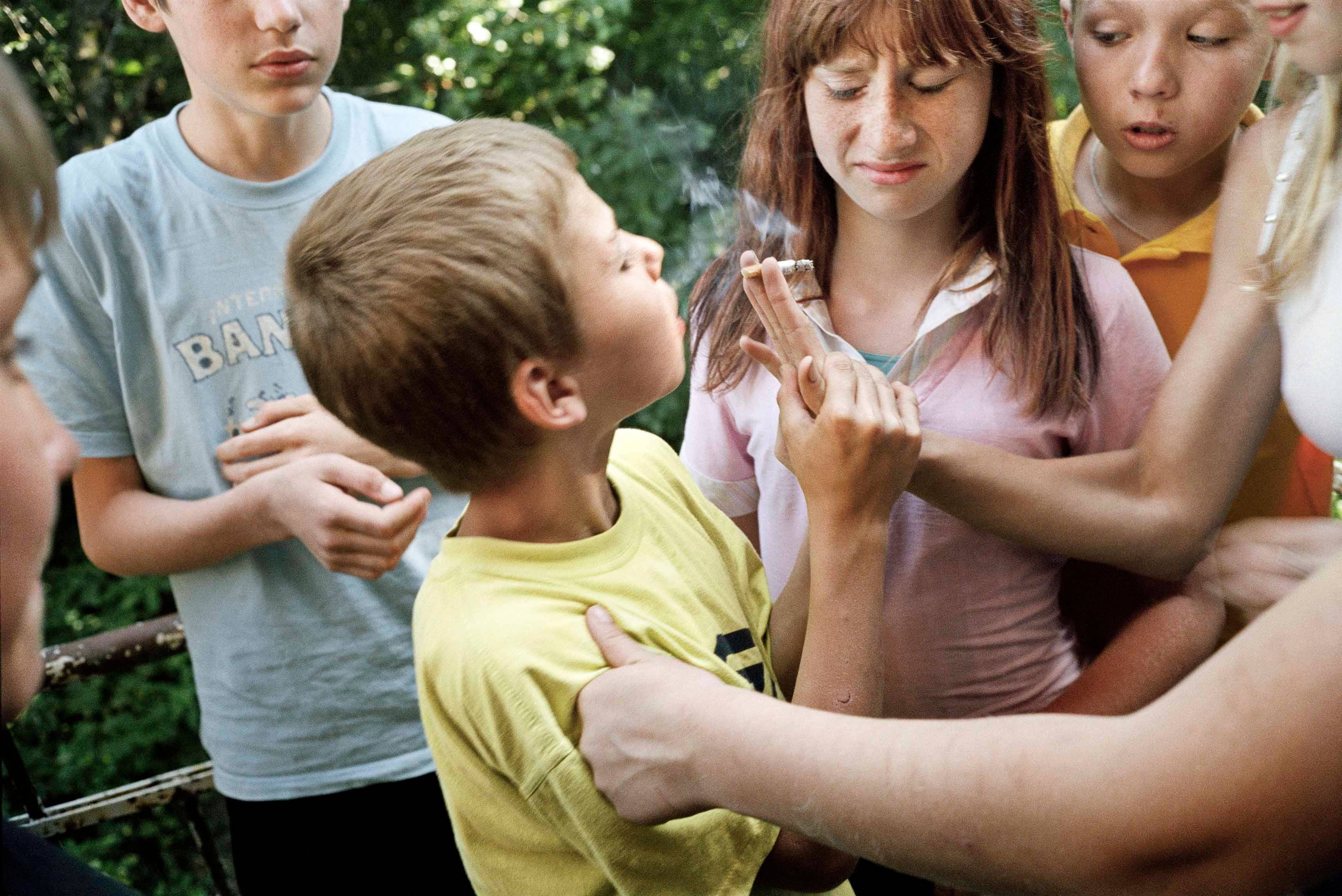 Jim Goldberg, UKRAINE. 2006. In the outskirts of Kiev street kids teaching a young boy to smoke. Magnum