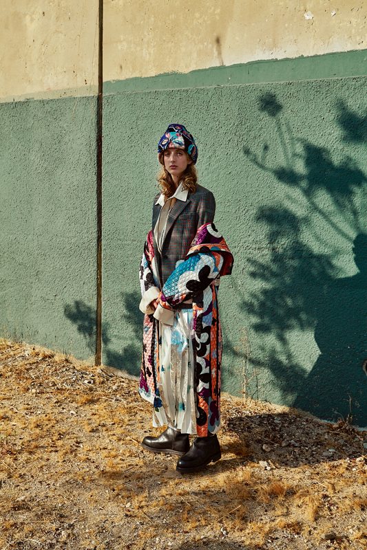 Printed quilted silk coat and hat, EMILIO PUCCI. Wool jacket, GOLDEN GOOSE DELUXE BRAND. Cotton shirt, DRIES VAN NOTEN. Printed pleated silk skirt, MSGM. Boots, CALVIN KLEIN.