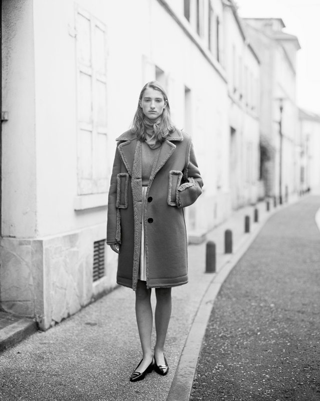 Wool and cashmere coat, wool pull and silk skirt, LOUIS VUITTON. Shoes, LACOSTE. 