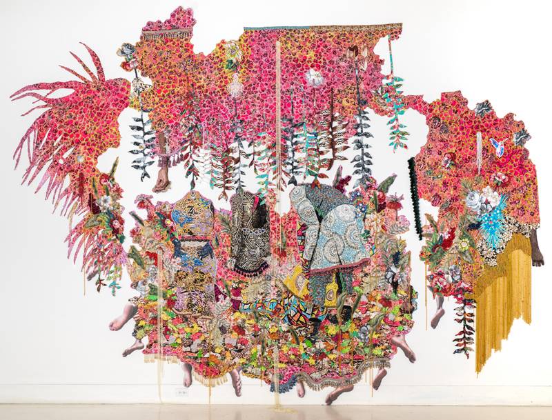 Ebony G. Patterson. “. . . they stood in a time of unknowing . . . for those who bear/bare witness”, 2018. Hand cut jacquard photo tapestry with glitter, appliques, pins, embellishments, fabric, tassels, brooches, acrylic, glass, pearls, beads, hand cast heliconias, and artist-designed fabric wallpaper (not pictured). Courtesy the artist and Monique Meloche Gallery, Chicago.
