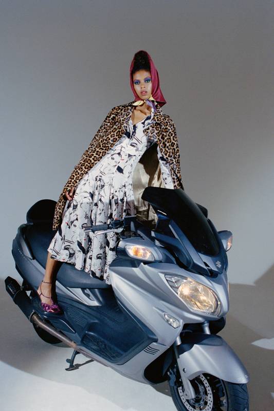 <p>Leopard style pony trench coat and printed silk dress, MICKAEL KORS COLLECTION. Scarf, HERMÈS. Shoes, KENZO.</p>
