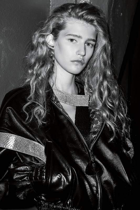 <p>Leather jacket and dress, LOUIS VUITTON. Earring, ANNELISE MICHELSON. </p>
